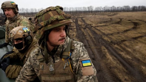 Ukrainian soldiers with the 43rd Heavy Artillery Brigade sit atop 2S7 Pion self propelled cannon on the battlefield, as Russia's attack on Ukraine continues, during intense shelling on the front line in Bakhmut, Ukraine, December 26, 2022.