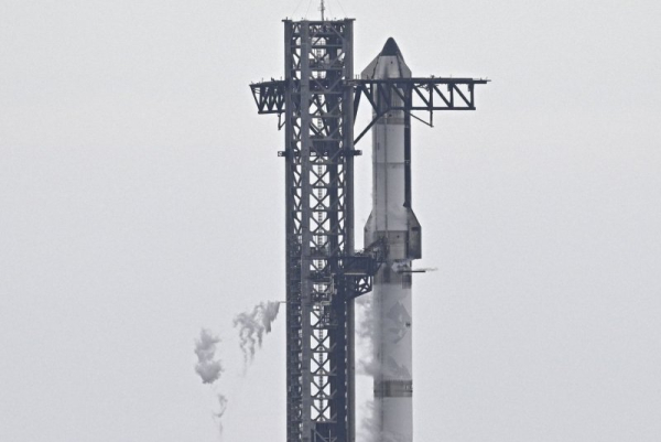 A fully fueled SpaceX Super Heavy Booster and Starship spacecraft stand on Launch Complex 1 as mission managers have decided to postpone the launch attempt for a second time at Starbase, Texas, on Monday. Weather issues were the cause of the scrub. Photo by Joe Marino/UPI